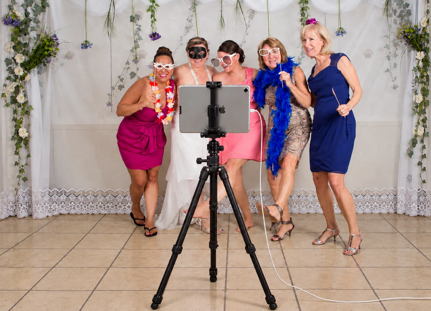 An iPad photo booth and guests at Margo and Manuel’s wedding